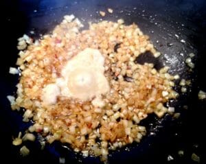 Frying-onion-ginger-garlic till done